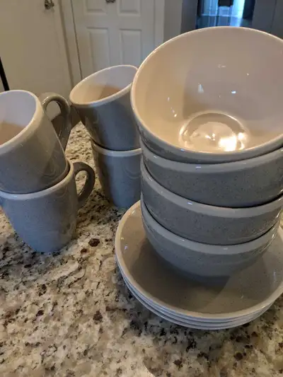 This is a gray sand set of Melanie Gourmet Basics dishes by Mikasa, It is including bowls, mugs and...