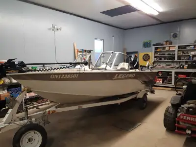 2007 Legend X Caliber fish and touring boat 75 mercury 4 stroke engine with live well, electric trol...