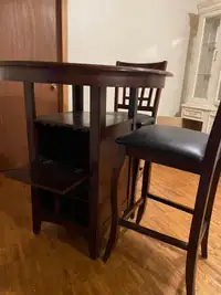 Bar height table with 2 leather chairs