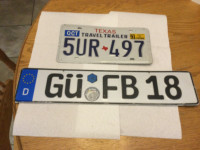 Vintage Texas and European license plates