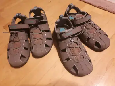 I have 2 pairs of brand new never worn women's Teva Sport Sandals size 9. Very supportive shoes with...