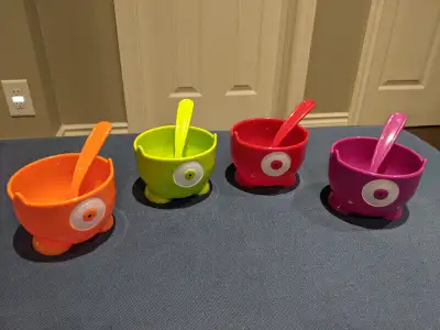 EUC 12 Ounce capacity. Set includes four bowls with matching spoons. Colours: Red, Orange, Green, Pu...