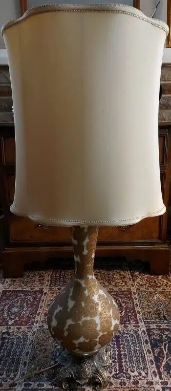 * LAMP IN EXCELLENT CONDITION * 37 inches to top of shade Ornate brasstone base Shade has a tear on...