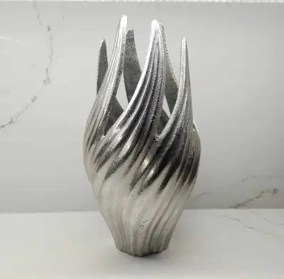 Silver-colored aluminum decorative vase with a flame / wave desi, View more