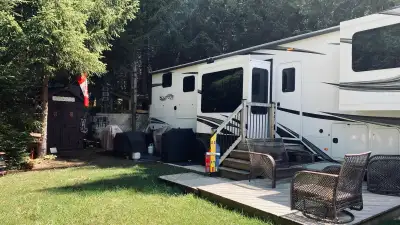 Experience luxurious comfort in this well-maintained 2022 Grand Design Solitude 380FL, offering a sp...