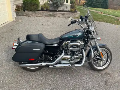 2015 Harley Sportster 1200. Very low mileage at 17,500 km. Just installed new tires and battery. Com...