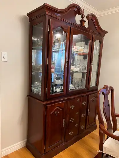 Beautiful hutch and buffet china cabinet with light on the top. There are two parts which can be sep...