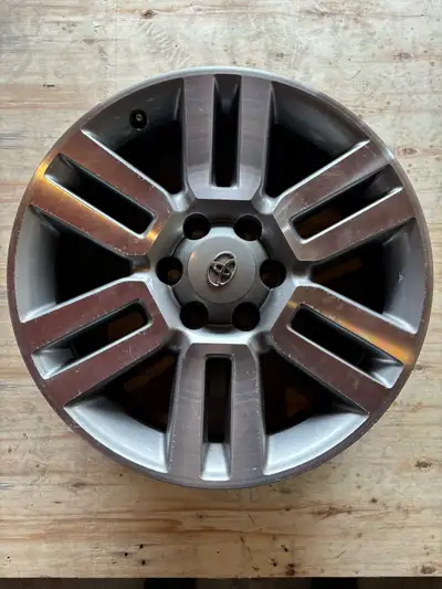 2011 Toyota 4Runner alloy rim (20x7). Rim has minor curb rash. Call or text 289-260-8347.