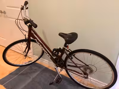 In good condition, colour burgundy, 24-speed, weight 29lb. with aluminum frame. Comes with kickstand...