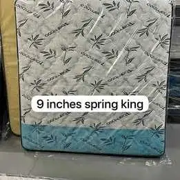 This is a brand new, 9-inch thick King spring mattress, still sealed in its original packaging. It f...