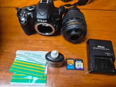 Nikon D5100 with 55 mm lens and accessories, View more