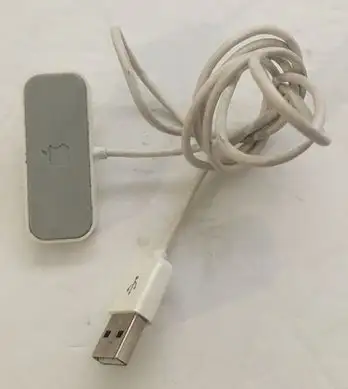 This is an Apple iPod Shuffle Charging Dock, USB to 3.5 mm audio plug. It is in good condition. / VO...