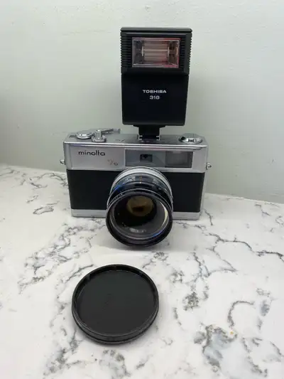 Minolta 7 camera with Flash $225.00