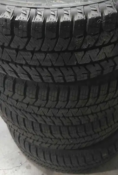 One set of four 2024 almost brand new Bridgestone WS90 winter tires and new rims for sale: Tire size...