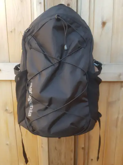 New Patagonia Refugio 30L daypack/backpack in Black. The largest of our core daypack line, the Refug...