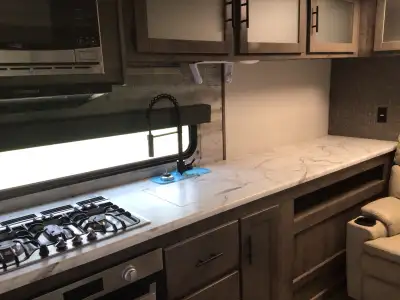 Beautiful mint condition Connect travel trailer. Theatre seating with heated, vibrated chairs. Outsi...