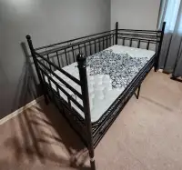Twin mattress and bed rail.