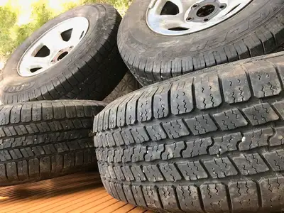 set of 4 slightly used (only one winter used) tires on rims with caps and lug nuts. Treads show no s...