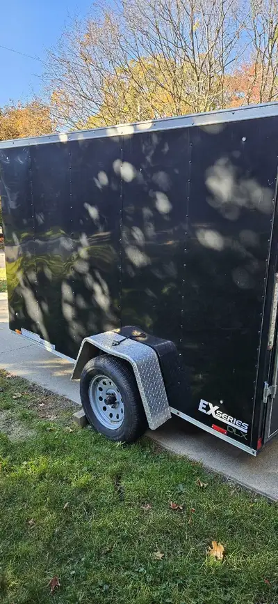 2018 6 foot by 10 feet fully enclosed rear drop down trailer for sale. $4,800 OBO. Text if you would...