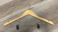 Wooden hangers with clips for trousers and skirts