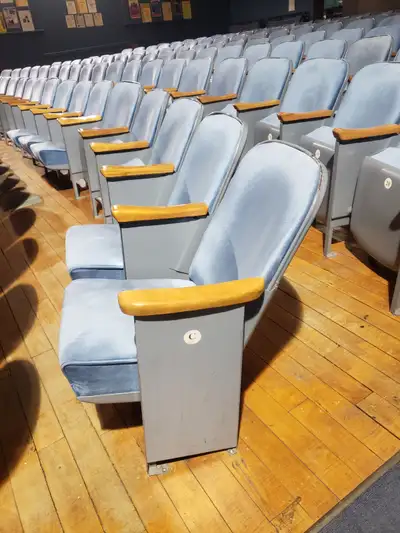 140 original blue vintage theater seats available. 7 rows of 20 seats. Estimated to be from the 60's...