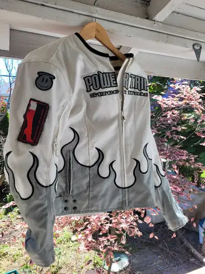 Rev up your wardrobe with this striking Power Trip Street Legal motorcycle jacket, featuring eye-cat...