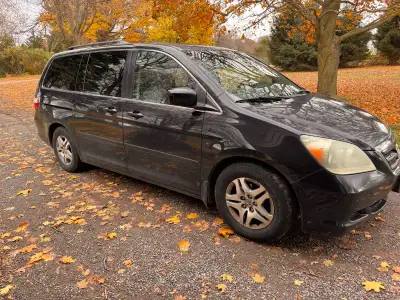 The 2006 Honda Odyssey, a reliable minivan, is perfect for families or anyone needing extra space an...
