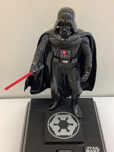 Dating from 1996 is a Star Wars Darth Vader Electronic Talking Bank. The Darth Vader talks to you an...