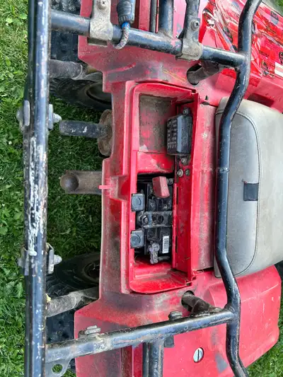Looking for battery cover that goes under the rear rack of a 1990 Honda TRX 350D 4 wheeler