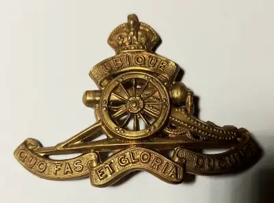 Original WW2 hat badge, Royal Artillery Kings Crown for $50 and a RCAF uniform button for $20 or bot...