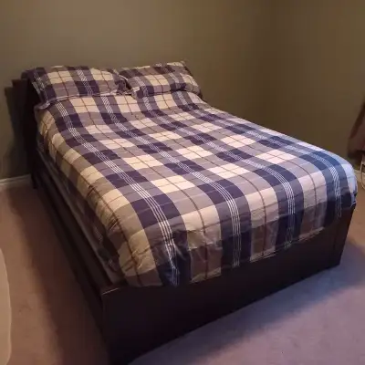 Ikea bed with drawer system underneath, great condition. Comes with box-spring and posturepedic matt...