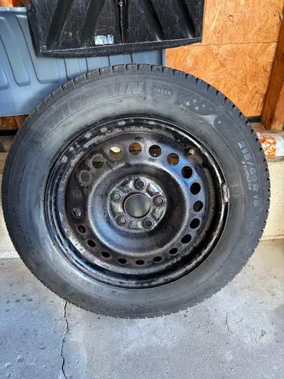 Michelin X-Ice 215/60R16 winter tires on rims. Still lots of wear left.