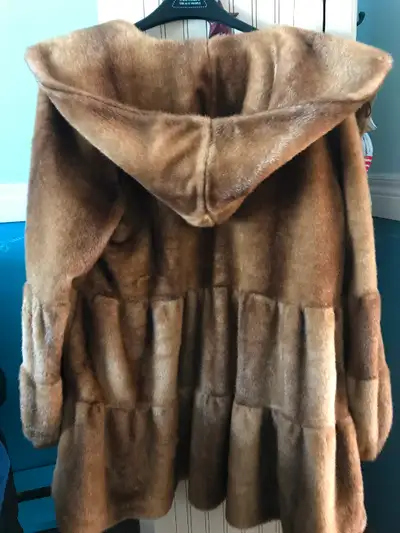 Beautiful faux fur swing coat with hood from Jones of New York. New. Never worn. Very well made and...