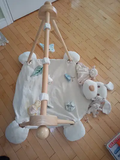 Organic soft doggie baby play mat with wooden sides and hanging toys. Freshly washed. In great condi...