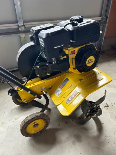 Bought brand new in 2024. This 212 CC Champion rear tine tiller is ready to get to work in your gard...