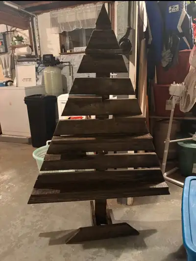 Home made pallet tree with shelves. Cute with mini lights in it. $25