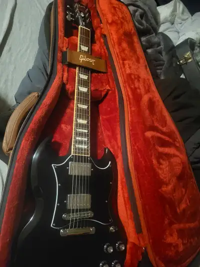 2019 Gibson SG standard. Pretty much mint condition. couple very light scratches/swirl marks where i...