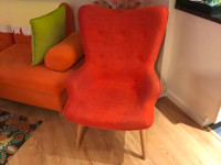 Orange arm chair for sale.  In good shape and  clean.