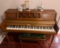 Wurlitzer piano with bench