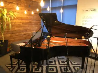 Rehearsal studio with Yamaha grand piano, View more