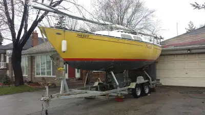 Decent shape older sailboat from early 80's. Comes with trailer.