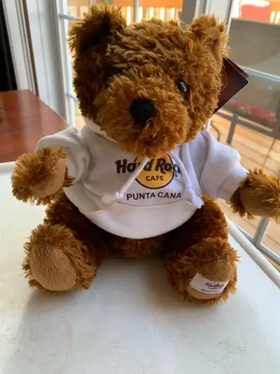 Brand new with tags. Brown teddy bear wearing a white hoodie from Hard Rock Cafe Punta Cana Herringt...