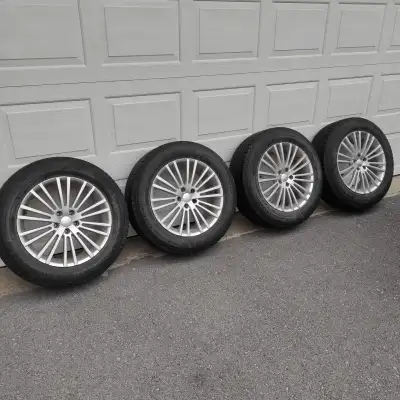 235/60/18 used Winter Tires on Rims. 5x112 bolt pattern. Some weather cracking, but the tread is fin...