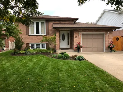Warm, cozy and immaculately maintained 4/5 bedroom two bath bi-level bungalow with lower level In-La...
