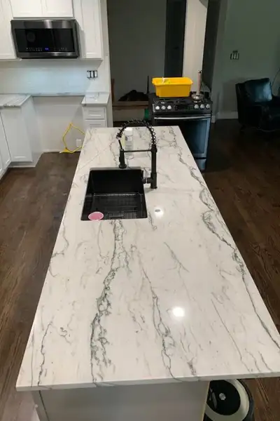 Calacatta-style quartz waterfall island l Kitchen Countertops, View more