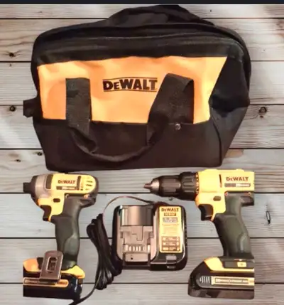 This DeWalt 20V MAX cordless drill combo kit includes a drill/driver, impact driver, charger, two ba...