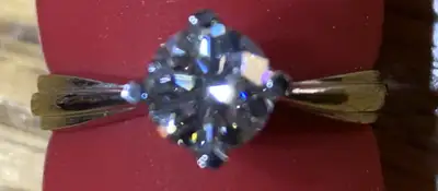 I have a 18K white gold and diamond solitaire ring, set with one round brilliant cut GIA certified V...