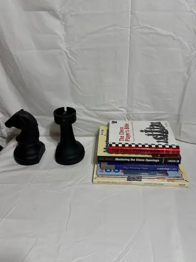 Chess Piece Knight Rook Bookends and lot of 5 Chess instruction books Together $35.00 Separate $25.0...