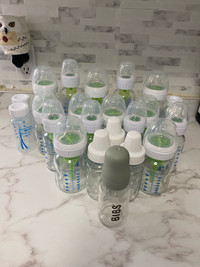 Glass baby bottles + plastic milk storage bottles