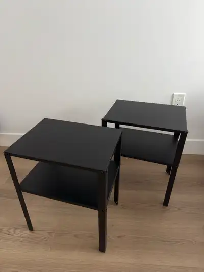 Spruce up your bedroom with this pair of sleek, black IKEA KNARREVIK nightstands, perfect for holdin...